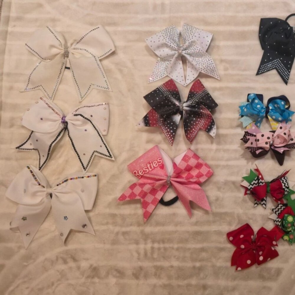 Lot of cheer bows in assorted colors. Some smaller clip bows